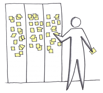 Someone puts down sticky notes on stickies wall.